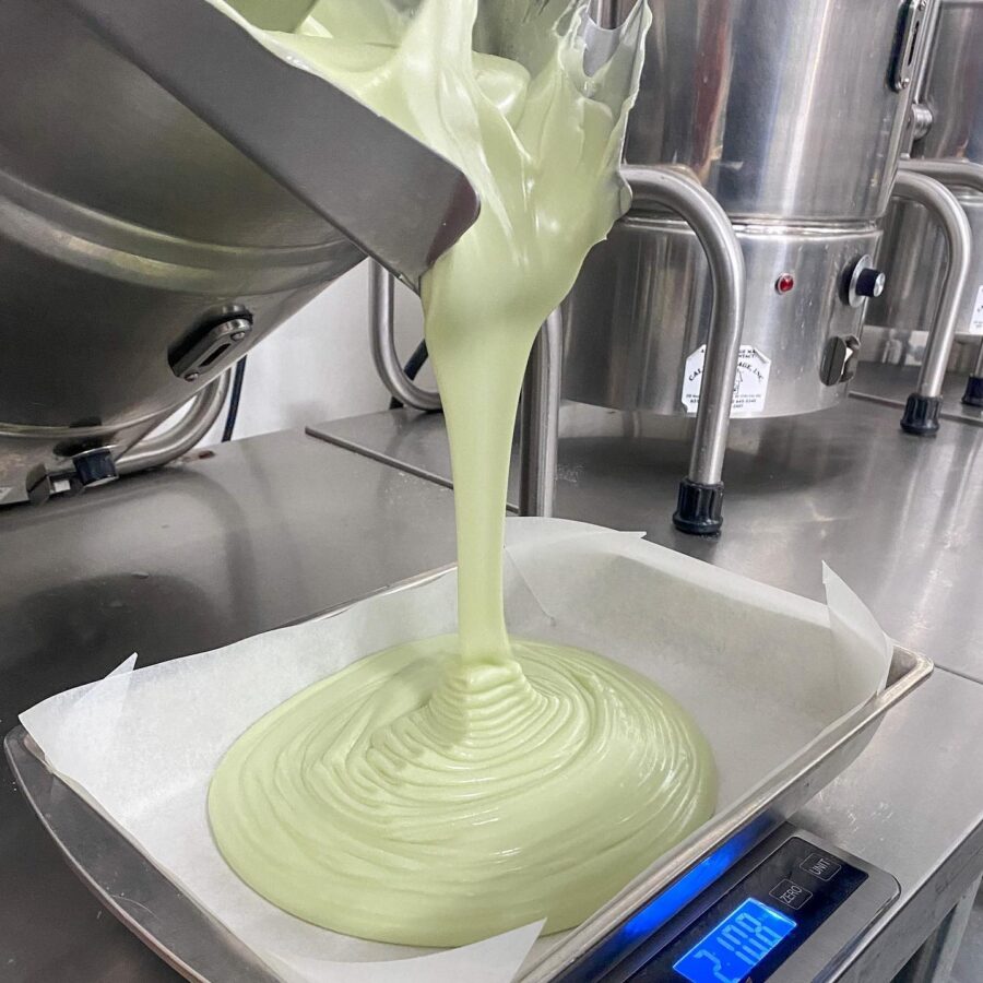 Dill Pickle Fudge being poured into baking tray for cooling