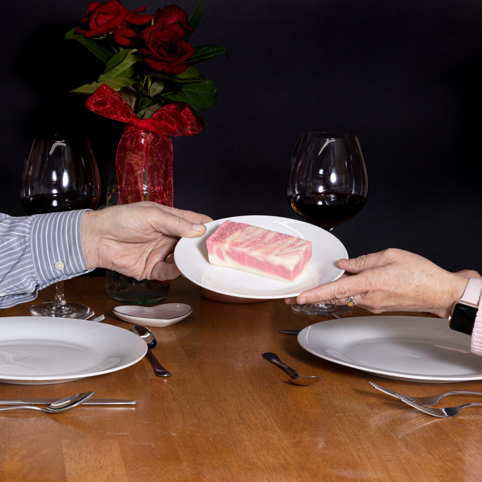 Strawberry Champagne Fudge being shared over a Valentine's Day dinner.